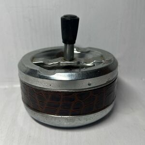 Gold Coin Metal ashtray with a snake-like pattern with a twist Made in Hong Kong